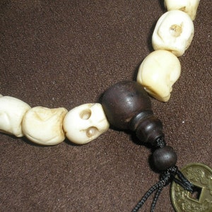 Carved bone skulls wrist mala: Large 11 mm size beads with wood guru beads