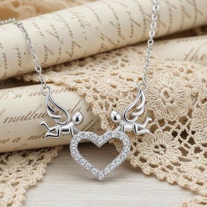 May include: A set of three ceramic mugs with a speckled, matte finish. The mugs are in shades of cream, light gray, and dark gray. Each mug has a simple, minimalist design, perfect for coffee or tea.