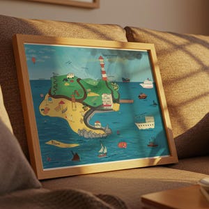 May include: A framed illustration of a whimsical island map, featuring a lighthouse, boats, and a winding road. The artwork is set against a blue sea and green land, with a light wooden frame. The image is resting on a brown sofa.