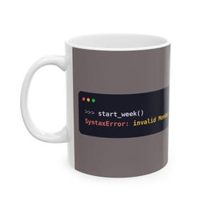 May include: A white ceramic mug featuring a dark grey rectangular graphic that mimics a computer terminal window. The text reads: >>> start_week() SyntaxError: invalid Monday. The design includes three small coloured dots at the top left.