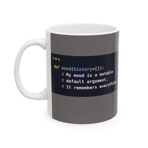 May include: A white ceramic mug featuring a dark gray rectangular graphic with Python code syntax. The text reads: def mood(history=[]): # My mood is a mutable # default argument. # It remembers everything. The mug has a curved handle on the left side.