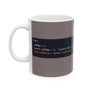 May include: A white ceramic mug featuring a dark gray rectangular graphic that displays computer code. The text reads: coffee = 0, assert coffee > 0, "Cannot start work", and AssertionError: Cannot start work, with colored syntax highlighting.