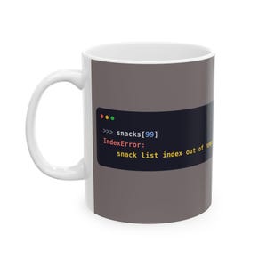 May include: A white ceramic mug featuring a dark gray rectangular graphic that mimics a computer terminal window. The text reads: >>> snacks[99] IndexError: snack list index out of range, displayed in white, red, and yellow font colors.