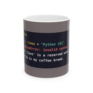 May include: A grey ceramic mug featuring a dark rectangular graphic with code text that reads: class = "Python 101", SyntaxError: invalid syntax, # 'class' is a reserved word, # So is my coffee break. The mug has a white interior and a smooth finish.