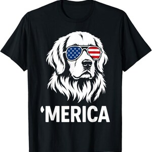 May include: A black short-sleeved t-shirt featuring a white graphic of a dog wearing sunglasses with an American flag pattern. The sunglasses have stars on the left lens and stripes on the right. Below the dog, the text reads 'MERICA in white.