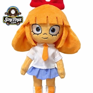 May include: A plush doll with orange hair, a red bow, and blue eyes. The doll wears a white shirt, blue skirt, orange tie, and white shoes with orange accents. The doll is a product of SoyToys.com.