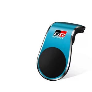 Könnte beinhalten: Ein türkis-schwarzer Autotelefonhalter mit dem Logo "GR SPORT" in Weiß, Rot und Schwarz. Der Halter hat eine schwarze kreisförmige Basis und eine silberne Umrandung.