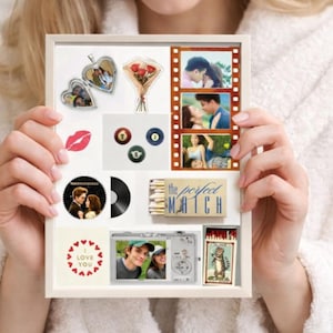 May include: A white framed collage featuring various romantic elements. Includes heart-shaped lockets, a bouquet of roses, film strip photos, a vinyl record, a camera, and the text "the perfect MATCH" and "LOVE YOU".