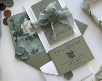 May include: Wedding stationery in sage green, featuring invitation cards, an RSVP card with a QR code, and envelopes. The invitation is adorned with a silk ribbon and a wax seal. The envelope has a floral design. The text reads "Please RSVP".