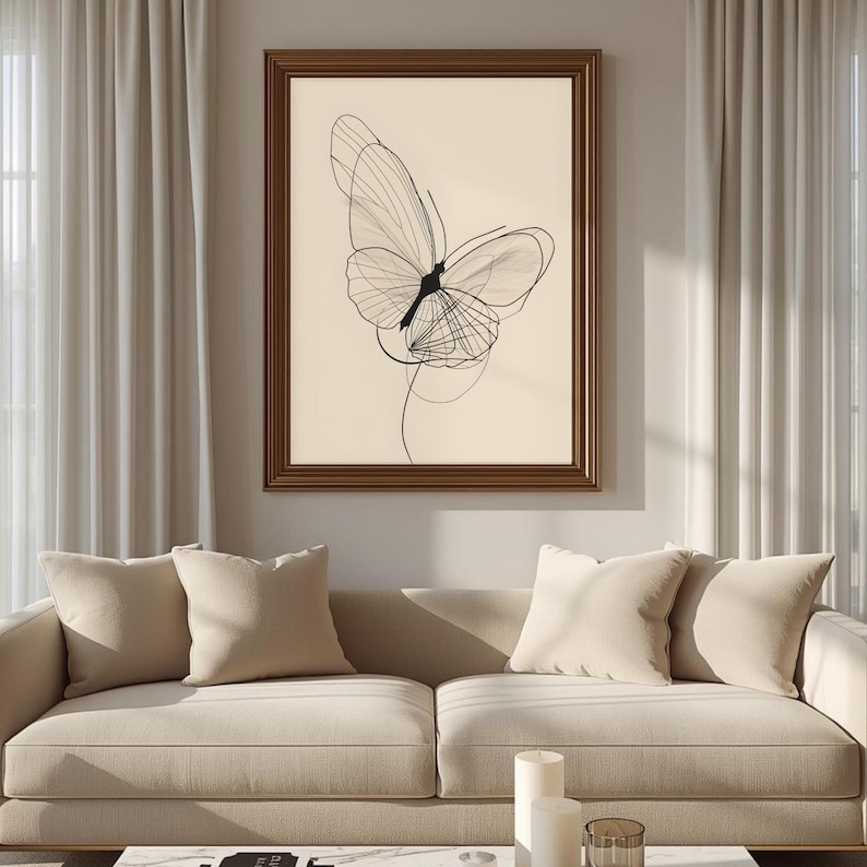 May include: A framed wall art print featuring a black line drawing of a butterfly on a light beige background. The butterfly is depicted with delicate, overlapping lines that create a sense of motion and transparency within a dark brown frame.