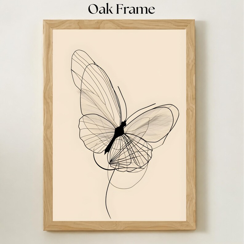 May include: A vertical rectangular wall art piece featuring a black line drawing of a butterfly on a light beige background, enclosed in a light-colored oak frame. The text Oak Frame is printed in black at the top center of the image.