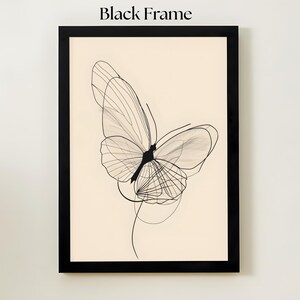 May include: A framed wall art piece featuring a black line drawing of a butterfly on a cream-colored background. The artwork is enclosed in a black frame. The text Black Frame is printed above the artwork. The butterfly design consists of thin, overlapping black lines that form the wings and body, creating a delicate, layered appearance.