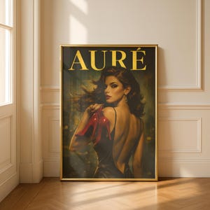 May include: A framed art print with a vintage magazine cover design. It features a woman holding red high heels, with the word "AURÉ" in gold. The woman is wearing a black dress, with a dark background.