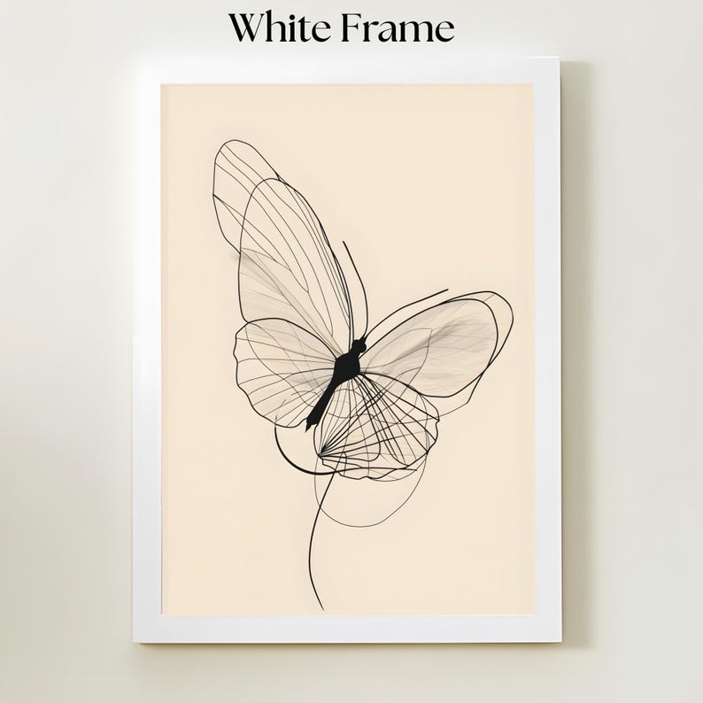 May include: A framed wall art piece featuring a black line drawing of a butterfly on a light beige background. The artwork is enclosed in a simple white frame. The butterfly design consists of thin, overlapping lines forming the wings.