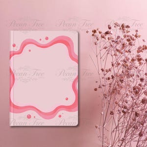 May include: A pink journal with a wavy, layered border in shades of pink. The journal has a light pink background with a darker pink border and small pink circles. The words "Pecan Tree Arts" are printed on the journal.