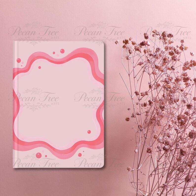 May include: A pink journal with a wavy, layered border in shades of pink. The journal has a light pink background with a darker pink border and small pink circles. The words "Pecan Tree Arts" are printed on the journal.