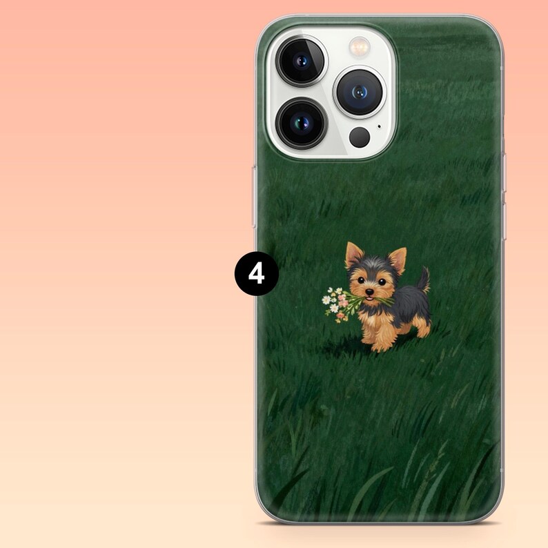 May include: A green phone case featuring a Yorkshire Terrier puppy holding a bouquet of flowers in its mouth. The puppy has black, brown, and tan fur and is set against a backdrop of green grass.