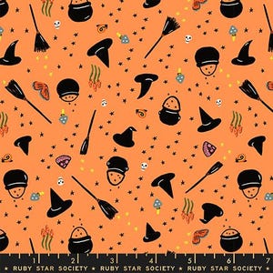 May include: An orange fabric featuring a repeating pattern of black witch hats, black cauldrons with orange contents, black broomsticks, small white skulls, blue mushrooms, orange butterflies, and snails, with a ruler showing 7 inches.