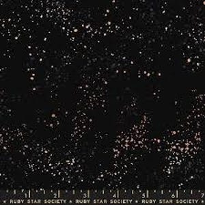 May include: Black fabric with a speckled pattern in shades of rose gold and white. The fabric has a ruler along the bottom edge with the text "RUBY STAR SOCIETY".
