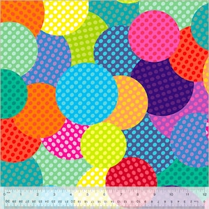 May include: A vibrant fabric featuring a colorful polka dot pattern. Overlapping semi-circles in shades of red, orange, yellow, green, blue, purple, and pink are covered with smaller white dots. A ruler is at the bottom, showing inches.
