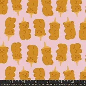 May include: A repeating pattern of golden-brown gummy bear shapes on a light pink background. Each bear is on a stick, some with a small, yellow cone on their heads. The text "RUBY STAR SOCIETY" is printed at the bottom.