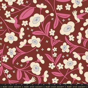 May include: A dark red fabric featuring a repeating pattern of cream-colored flowers with blue centers, pink stems and leaves, and small hummingbirds. The bottom edge displays a black border with the repeating white text Ruby Star Society.