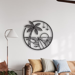 May include: Black metal wall art depicting a tropical beach scene. The circular design features a palm tree, surfboard, ocean waves, and a setting sun. The artwork is mounted on a white wall in a living room setting.