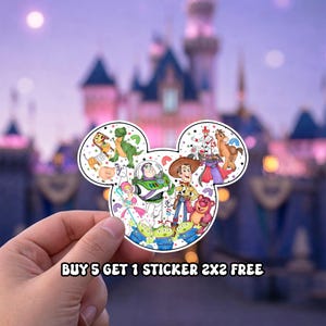 May include: A die-cut sticker shaped like a Mickey Mouse head silhouette featuring a collage of various animated characters including a space ranger, a cowboy, a pink bear, and green aliens, accented with small stars and rainbow icons.