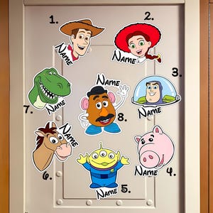 May include: A collection of cartoon character stickers, including a cowboy, cowgirl, dinosaur, horse, alien, pig, and Mr. Potato Head. Each sticker has the word "Name" written on it.