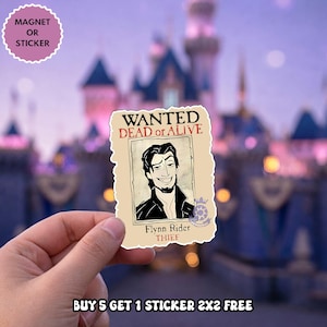 May include: A rectangular sticker or magnet featuring a beige wanted poster with a black and white illustration of a man with dark hair and a goatee. The text reads WANTED DEAD or ALIVE, Flynn Rider, and THIEF in black and red lettering.