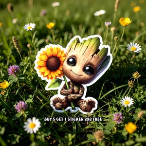 May include: A die-cut sticker featuring a cartoon character resembling a tree, holding a sunflower. The character has large black eyes and a smiling expression. The sticker is set against a background of green grass and wildflowers.