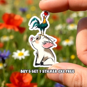 May include: A sticker featuring a cartoon pig with a rooster on its back. The pig is white with pink ears and a smiling expression. The rooster has red, green, and yellow coloring. The text "BUY 5 GET 1 STICKER 2X2 FREE" is at the bottom.