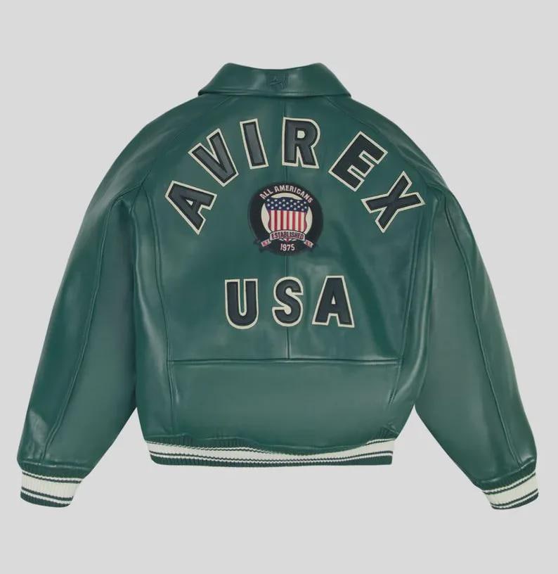 May include: A green leather jacket with the word "AVIREX" arched across the back in white lettering. Below the lettering is a patch with the words "ALL AMERICANS ESTABLISHED 1975" and the USA flag. The word "USA" is below the patch.
