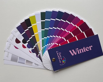 May include: A color palette fan with a variety of colors, including shades of pink, purple, blue, green, and yellow. The fan is labeled "Winter" and includes the name "Oxana Lawrence".