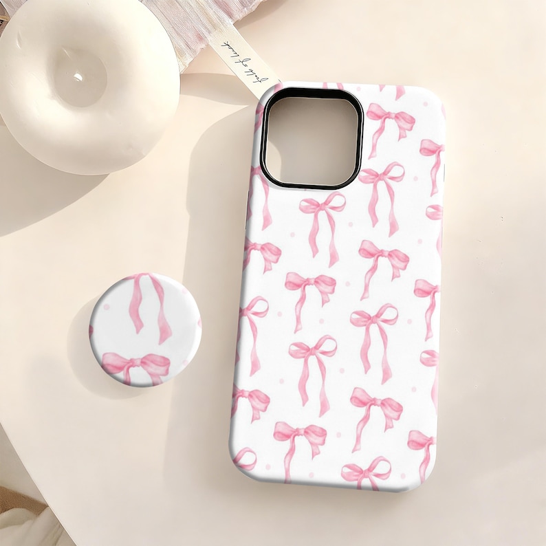 This pink bow phone case is both cute and durable.The adorable bow is lively and playful,full of girlish charm without being cloying.It's cute, versatile, and eye-catching.Made of high-strength shockproof material,it effectively resists scratches and drops,providing full protection for the camera and screen.The precise cutout design,sensitive buttons,and wireless charging support make it slim and comfortable for everyday use. It's the ideal choice for sweet girls and those who love girly styles.