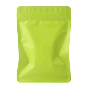 May include: A bright lime green, sealed, stand-up pouch. The pouch is empty and has a zip-top closure. The material is shiny and reflects light. The bag is designed for packaging food items or other small products.