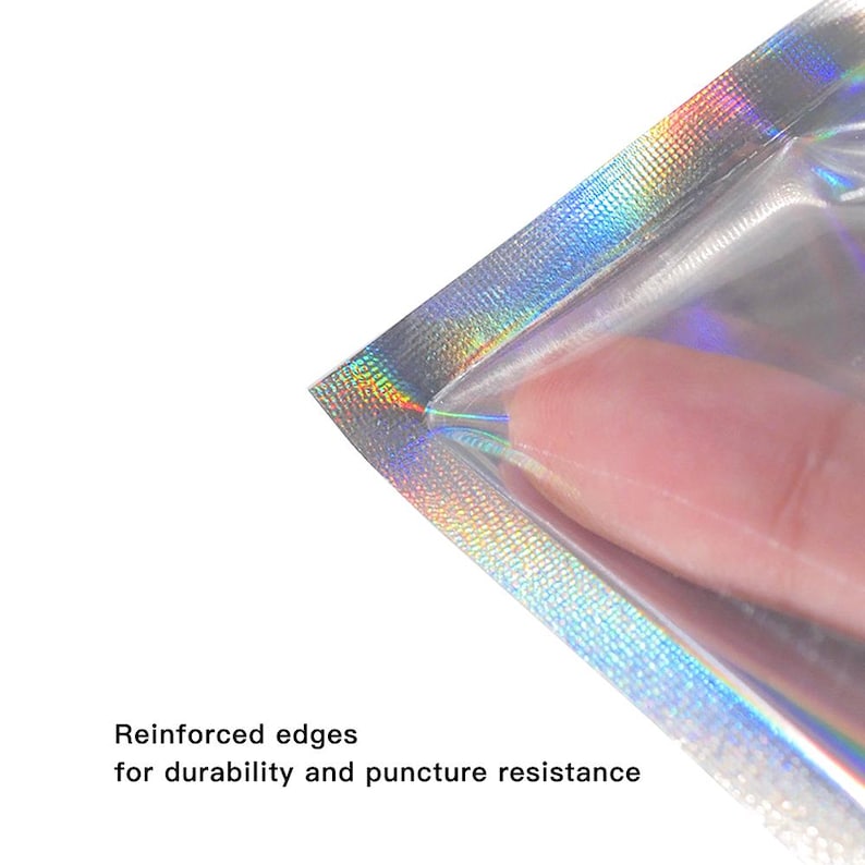 May include: Close-up of a clear, iridescent pouch with reinforced edges. The pouch is partially open, with a finger visible inside. Text at the bottom reads "Reinforced edges for durability and puncture resistance."