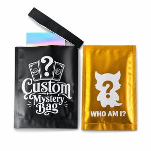 May include: A black pouch with a white graphic of three cards and the text Custom Mystery Bag, with a partially open top revealing a holographic card. Beside it is a gold pouch with a white creature silhouette, a question mark, and WHO AM I?