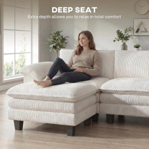 Pu&ograve; includere: Un divano componibile in velluto a coste color crema con seduta profonda. Il testo DEEP SEAT e Extra depth allows you to relax in total comfort &egrave; visibile in alto. Il divano presenta cuscini spessi e piedini a blocco marrone scuro.