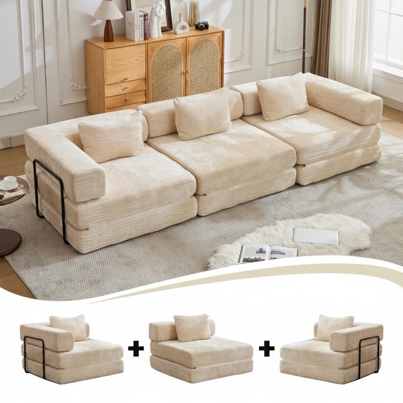May include: A modular sofa set featuring three individual cream-coloured, textured fabric floor chairs. Each chair has a low-profile design with a square back cushion and a black metal frame on the side. The pieces can be arranged together as a single long sofa or separated into individual seating units.