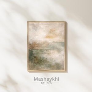 May include: Abstract landscape art print in a wooden frame. The artwork features a muted color palette of beige, green, and brown, with a textured, painterly effect. The print is displayed on a white wall with shadows.