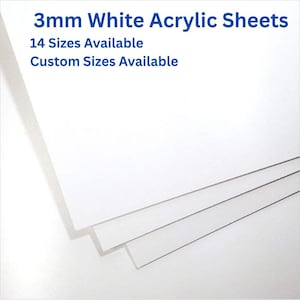 May include: A stack of 3mm white acrylic sheets. The image includes the text "3mm White Acrylic Sheets", "14 Sizes Available", and "Custom Sizes Available". The sheets are white and appear to be stacked on top of each other.