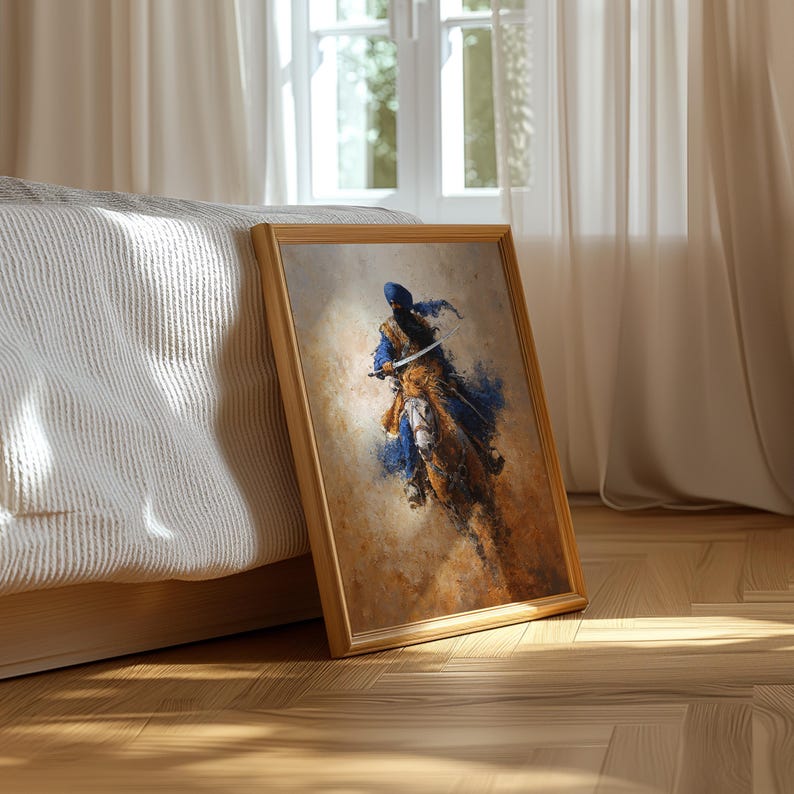 May include: A framed art print showing a figure on horseback, in blue, gold, and brown tones. The artwork has a painterly style, with visible brushstrokes and a textured appearance. The frame is made of light-coloured wood, adding a natural touch.