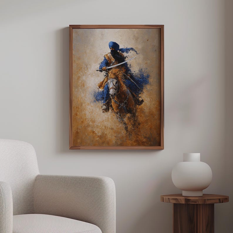 May include: A framed artwork showing a figure on horseback, painted in a painterly style. The rider, in blue and gold, holds a sword. The background has warm, earthy tones, with blue splashes. The artwork is displayed in a room with a neutral colour palette.