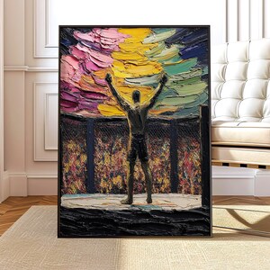 Puede incluir: Pintura al óleo abstracta de una figura con los brazos levantados en señal de victoria dentro de un ring de lucha. El fondo presenta un cielo colorido y texturizado con tonos rosas, amarillos y azules. La obra está enmarcada en negro.
