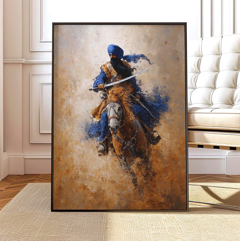 May include: An artistic painting shows a warrior on horseback, holding a sword. The warrior wears blue and gold clothing, with a blue turban. The horse is brown and white, set against a backdrop of earthy tones. The artwork is framed in black.