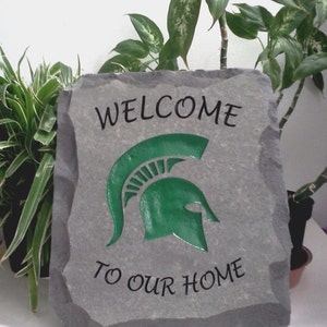 Engraved stone with Michigan State University logo