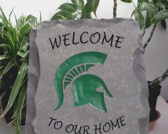 Engraved stone with Michigan State University logo