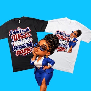 May include: A black t-shirt and a white t-shirt, both featuring the text "I don't rush What's mine knows my name" in red and blue, alongside a 3D-style illustration of a person in a blue suit, sunglasses, and a high bun hairstyle.