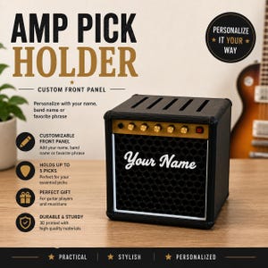 May include: Black amp pick holder with gold accents and the text "Your Name" in white. The holder is designed to look like a miniature amplifier and is customizable. The text "AMP PICK HOLDER" is at the top.